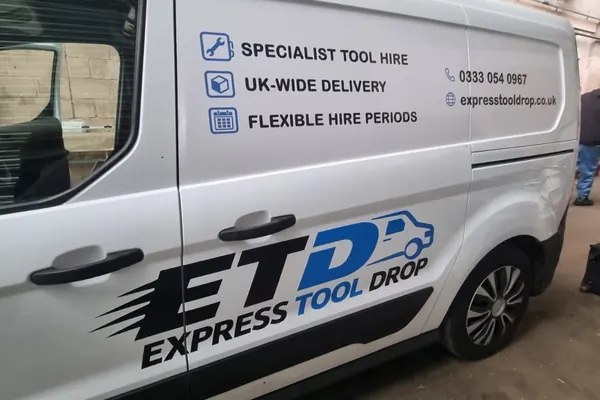 Close-up of the Express Tool Drop logo and service list on the side door